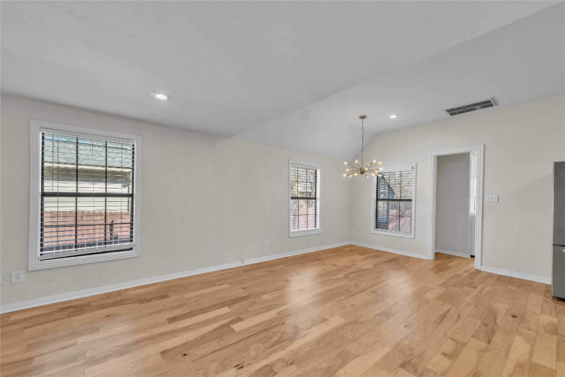 2403 South 3rd Street Austin, TX 78704 - Photo 10 of 29 a view of empty room with wooden floor and fan