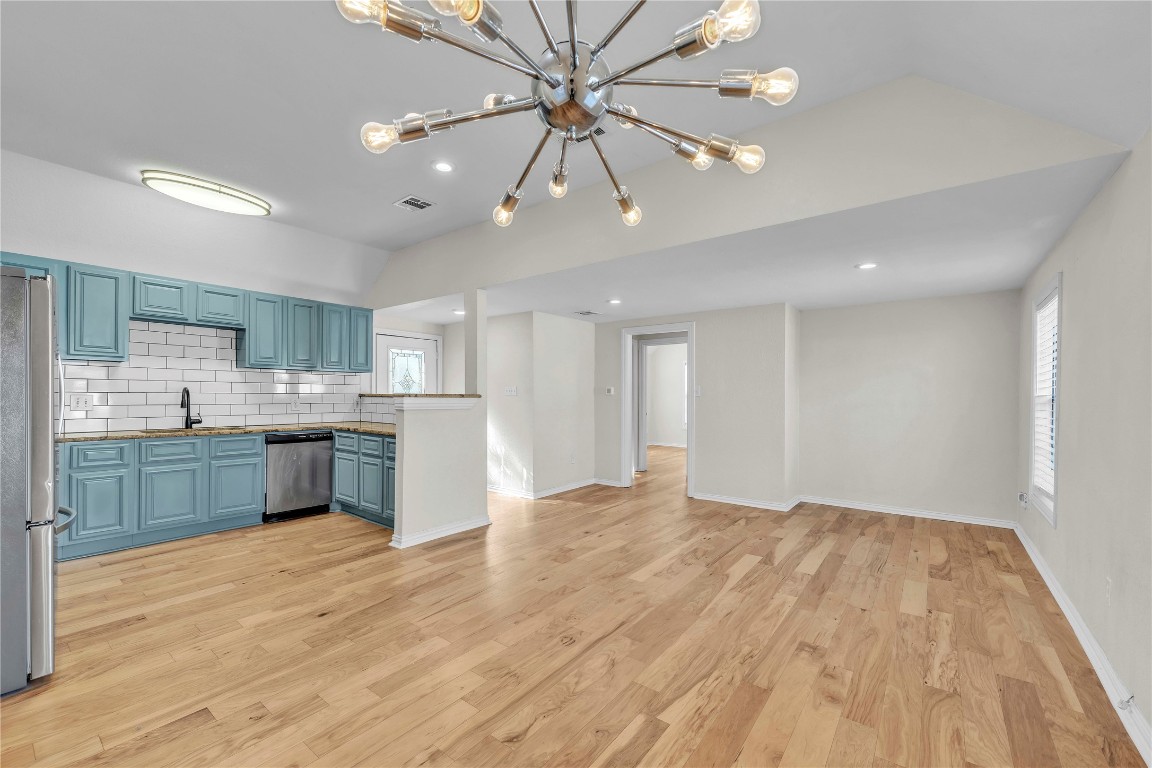 2403 South 3rd Street Austin, TX 78704 - Photo 29 of 29 a large kitchen with kitchen island a sink stainless steel appliances and cabinets