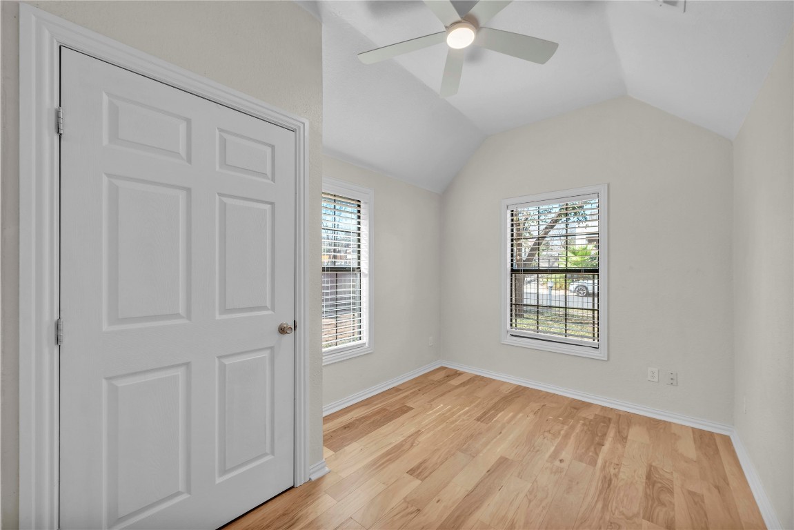 2403 South 3rd Street Austin, TX 78704 - Photo 15 of 29 an empty room with wooden floor and windows