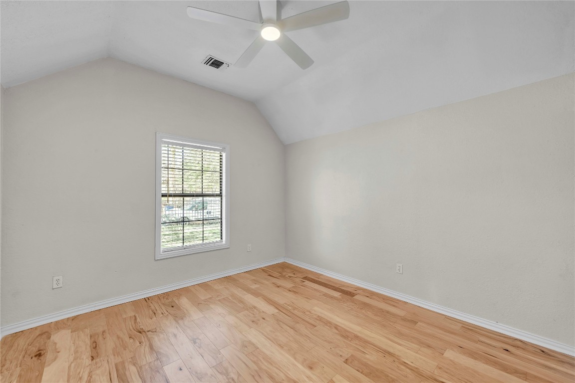 2403 South 3rd Street Austin, TX 78704 - Photo 16 of 29 Additional living space featuring lofted ceiling, light wood finished floors, and ceiling fan