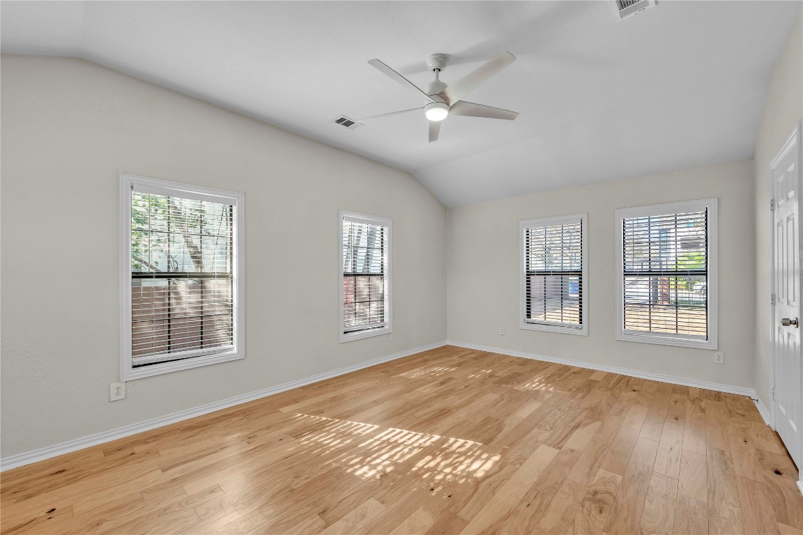 2403 South 3rd Street Austin, TX 78704 - Photo 20 of 29 a view of an empty room with a window and wooden floor