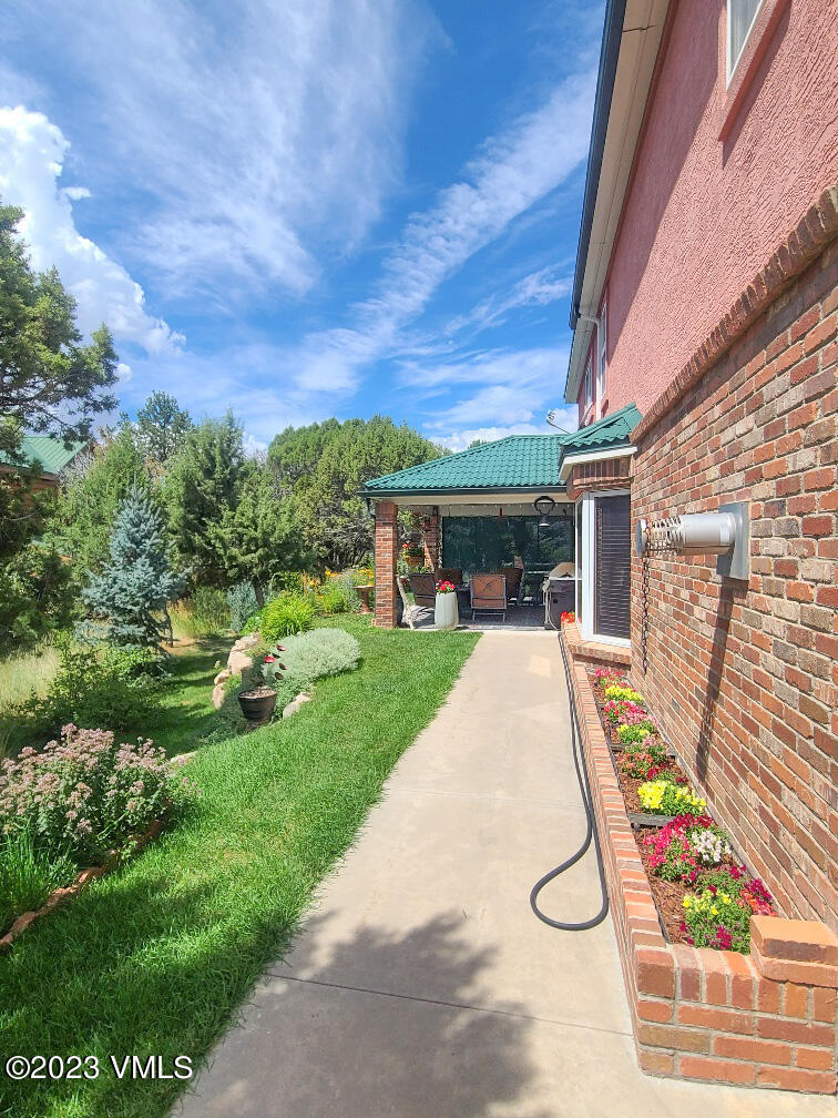 1072 Mesa Drive Eagle, CO 81631 - Photo 11 of 34 a view of a patio with table and chairs and potted plants