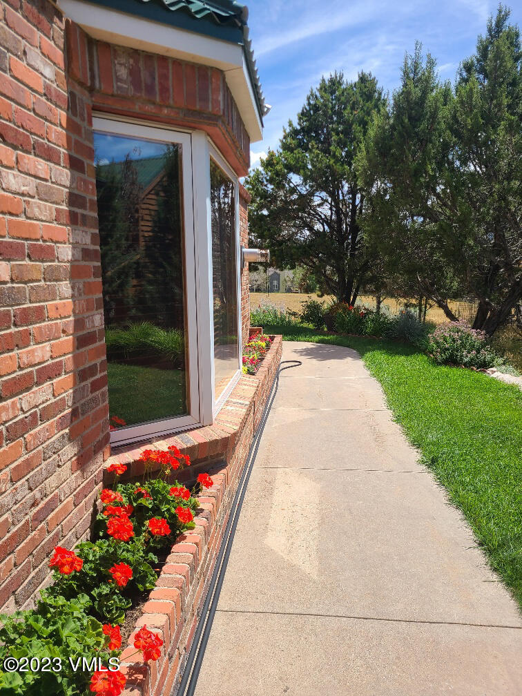 1072 Mesa Drive Eagle, CO 81631 - Photo 12 of 34 a view of flower garden in front of a house