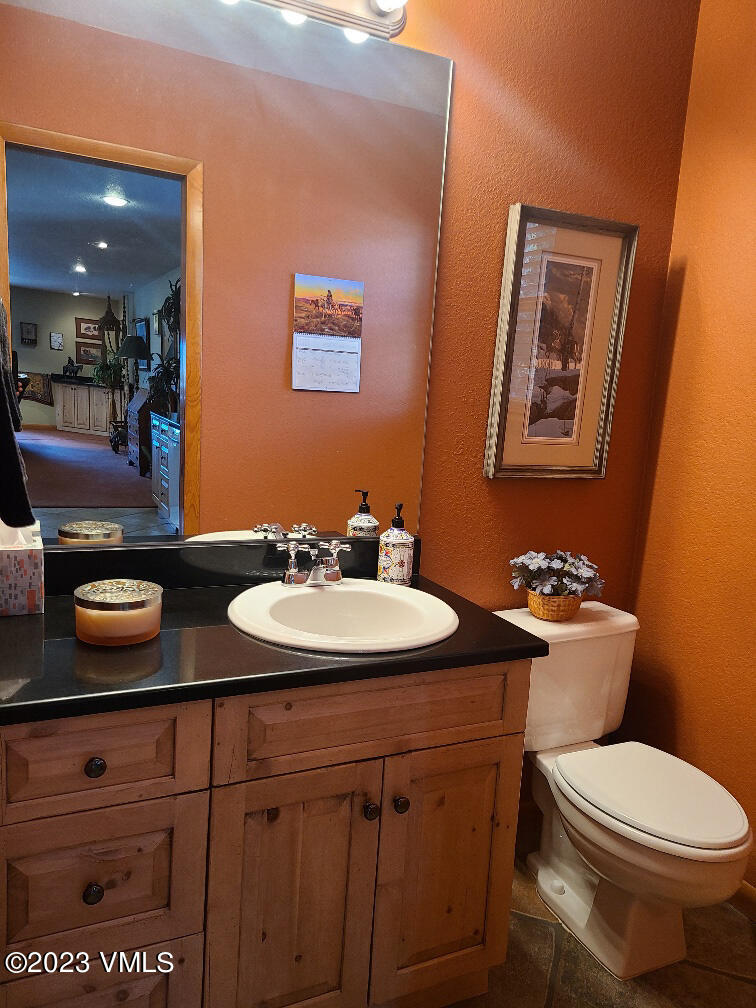 1072 Mesa Drive Eagle, CO 81631 - Photo 15 of 34 a bathroom with a toilet sink and mirror