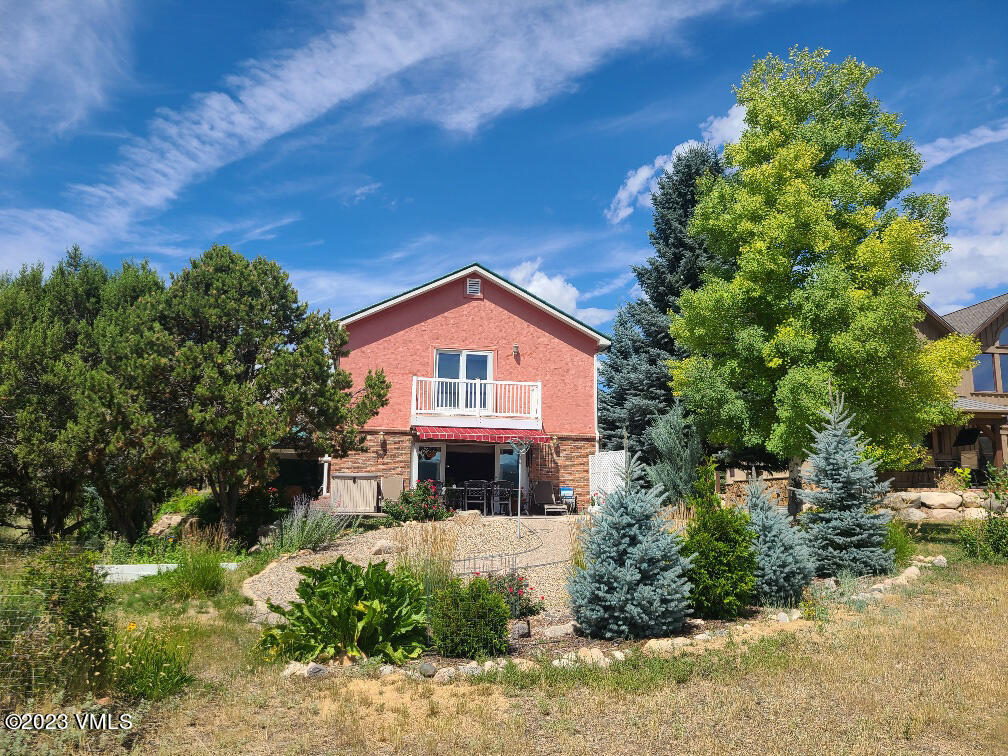 1072 Mesa Drive Eagle, CO 81631 - Photo 23 of 34 a front view of a house with a yard