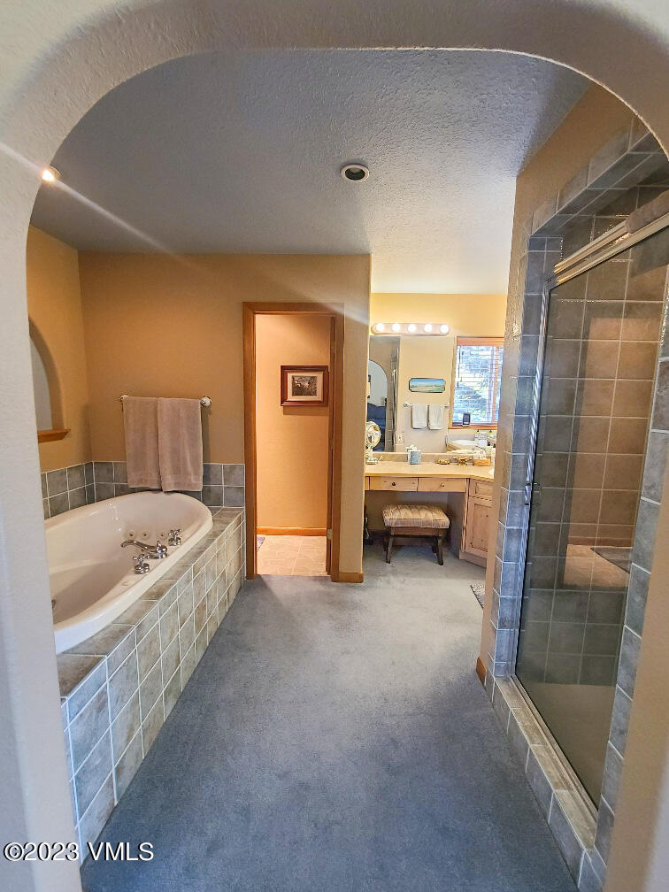 1072 Mesa Drive Eagle, CO 81631 - Photo 28 of 34 a bathroom with a tub a sink and a shower