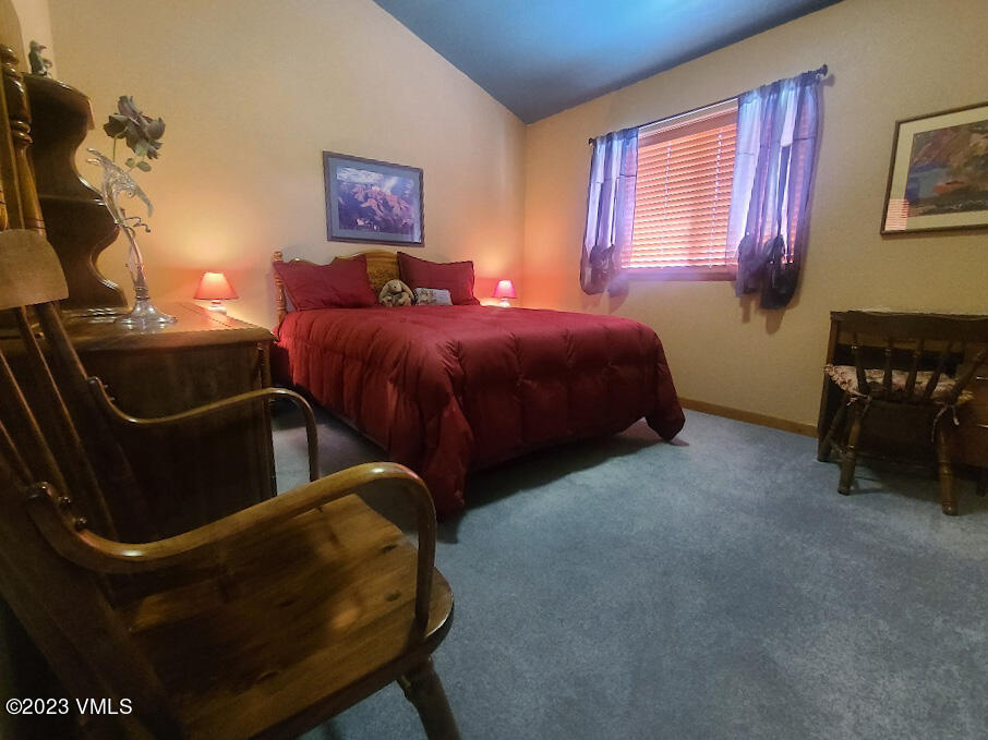 1072 Mesa Drive Eagle, CO 81631 - Photo 30 of 34 a bedroom with a bed and a chair