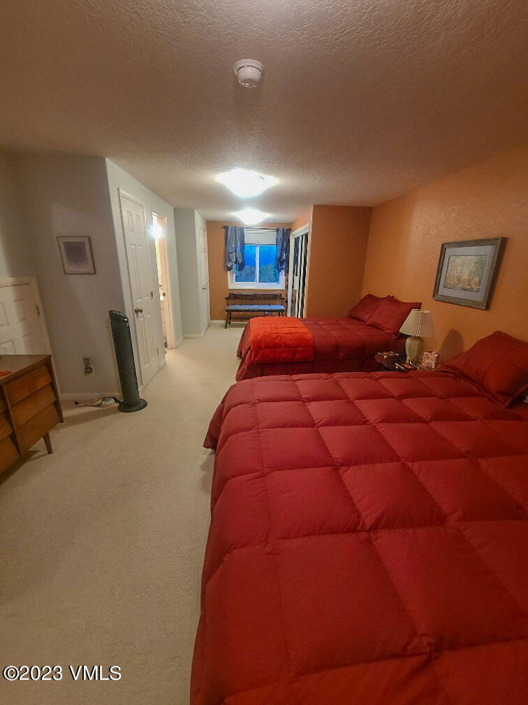 1072 Mesa Drive Eagle, CO 81631 - Photo 31 of 34 a bedroom with a bed and a night stand