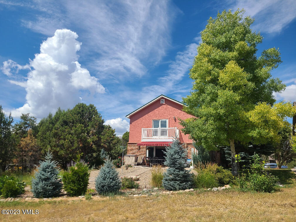 1072 Mesa Drive Eagle, CO 81631 - Photo 34 of 34 a view of a house with a small yard and plants