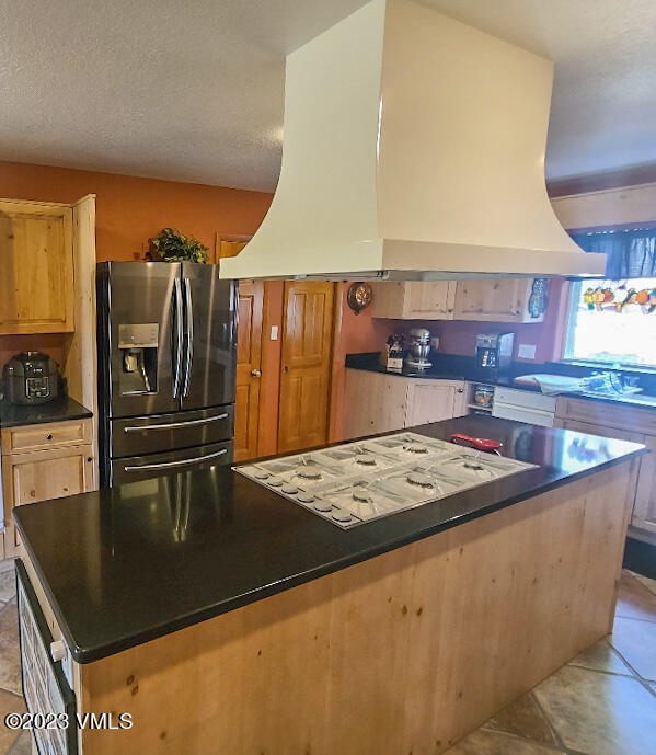 1072 Mesa Drive Eagle, CO 81631 - Photo 5 of 34 a kitchen with stainless steel appliances granite countertop a sink a stove and a refrigerator