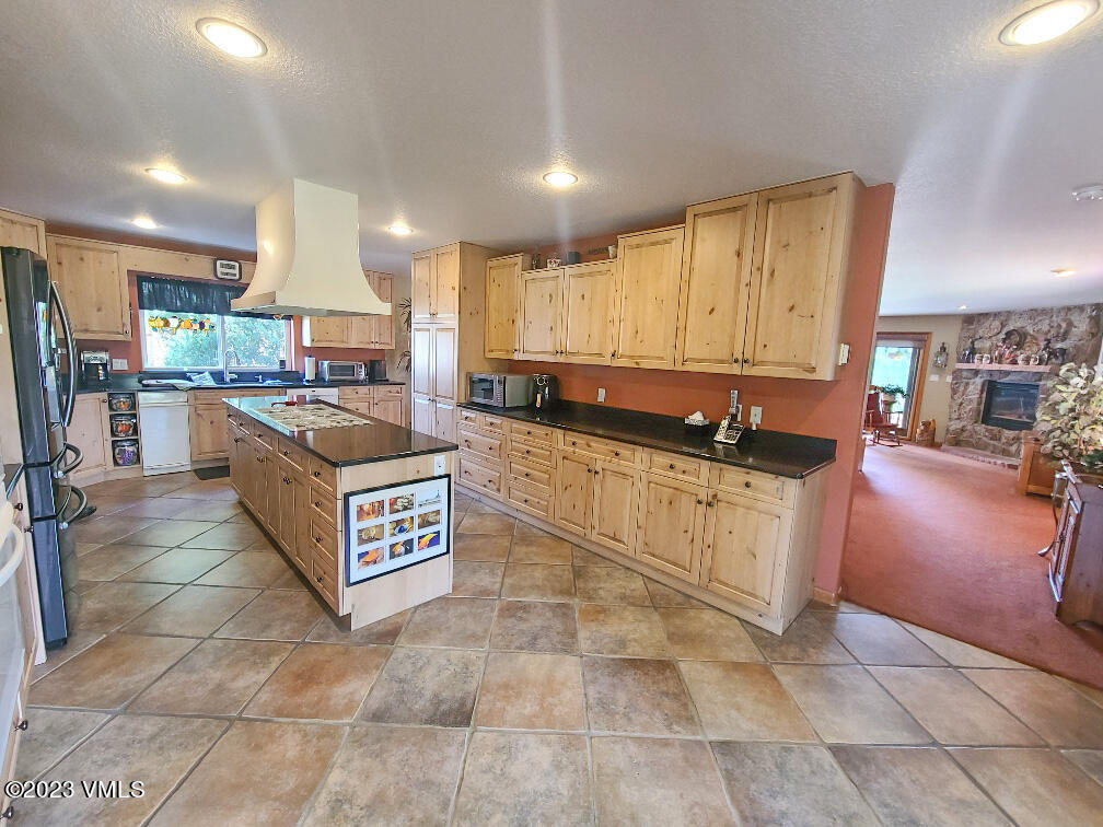 1072 Mesa Drive Eagle, CO 81631 - Photo 6 of 34 a kitchen with stainless steel appliances granite countertop a stove a sink and a refrigerator