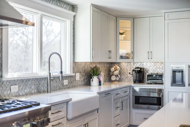 a kitchen with a stove and a refrigerator