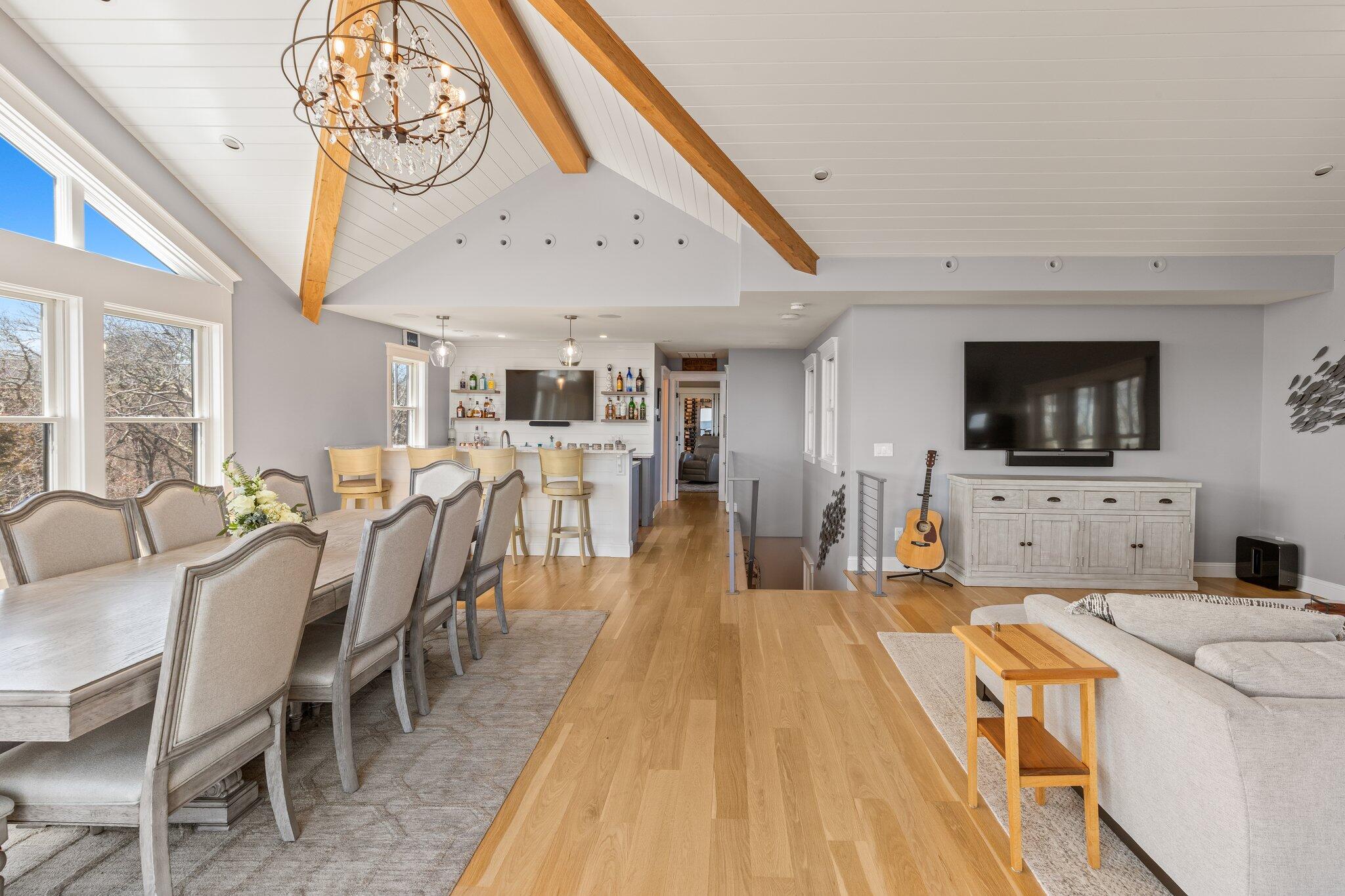 87 Oyster Pond Road Falmouth, MA 02540 - Photo 18 of 105 a view of a dining room with furniture wooden floor and a flat screen tv