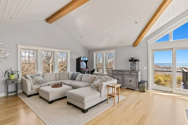 a view of a livingroom with workspace and a window