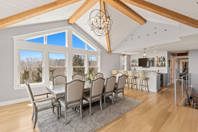 a bathroom with a sink a toilet a mirror and shower