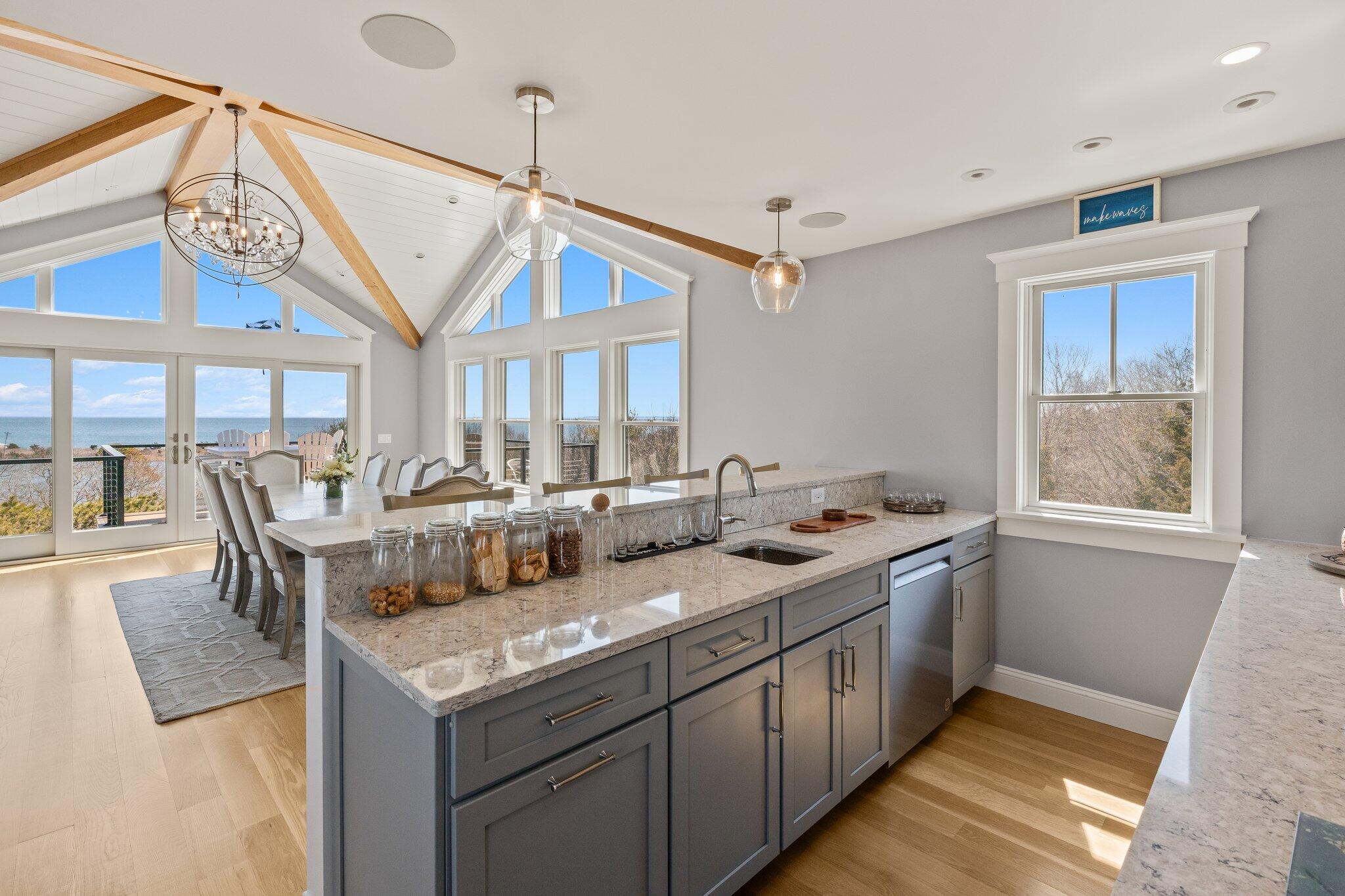 87 Oyster Pond Road Falmouth, MA 02540 - Photo 25 of 105 a kitchen with a stove and a refrigerator