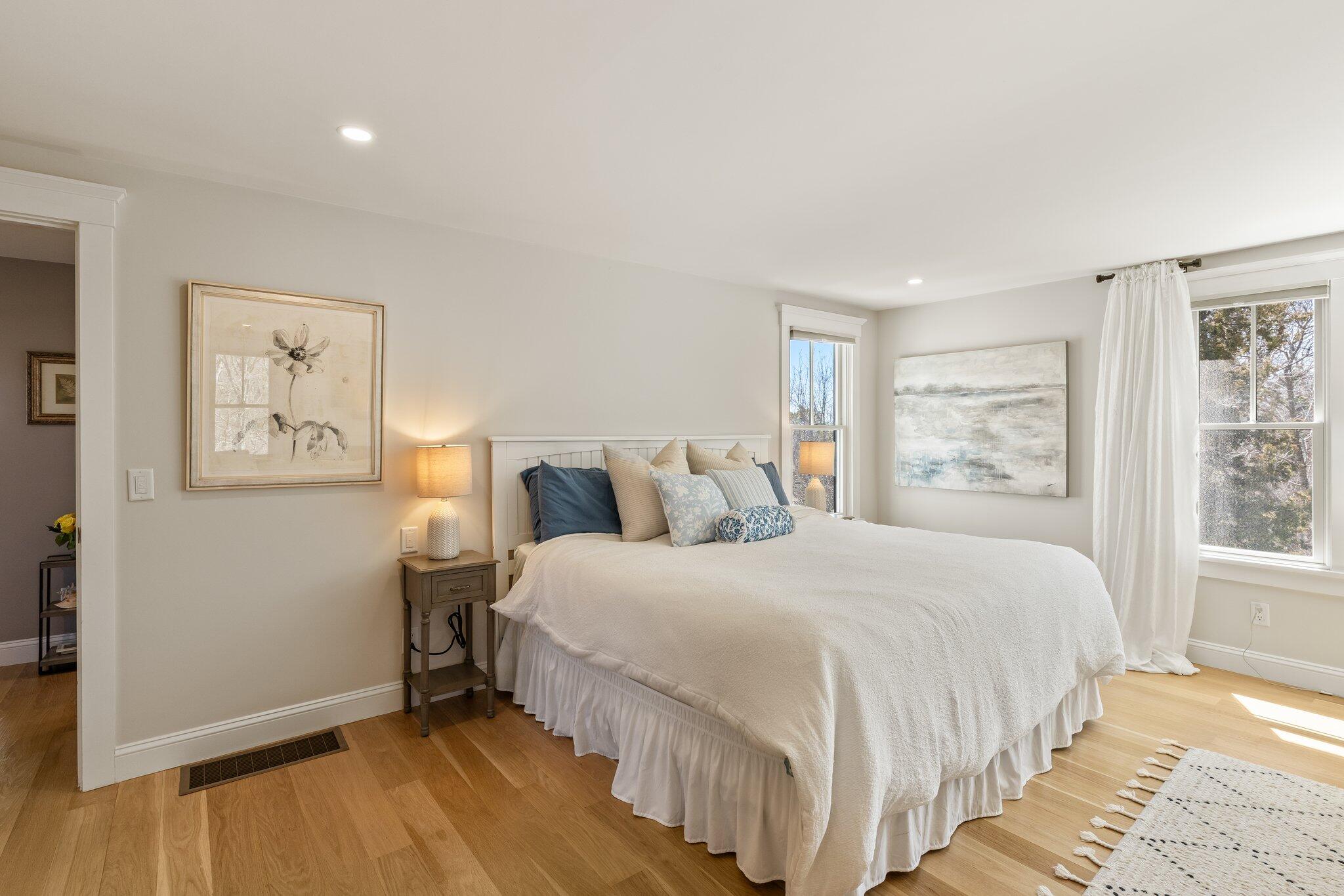 87 Oyster Pond Road Falmouth, MA 02540 - Photo 28 of 105 a bedroom with a bed and a window