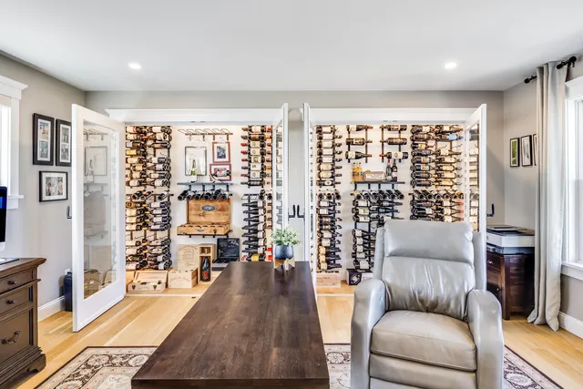 a view of a lake with lawn chairs