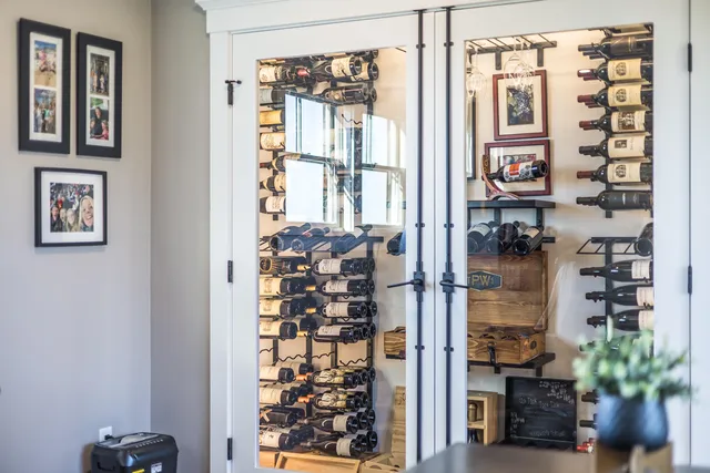 a aerial view of a house next to a yard