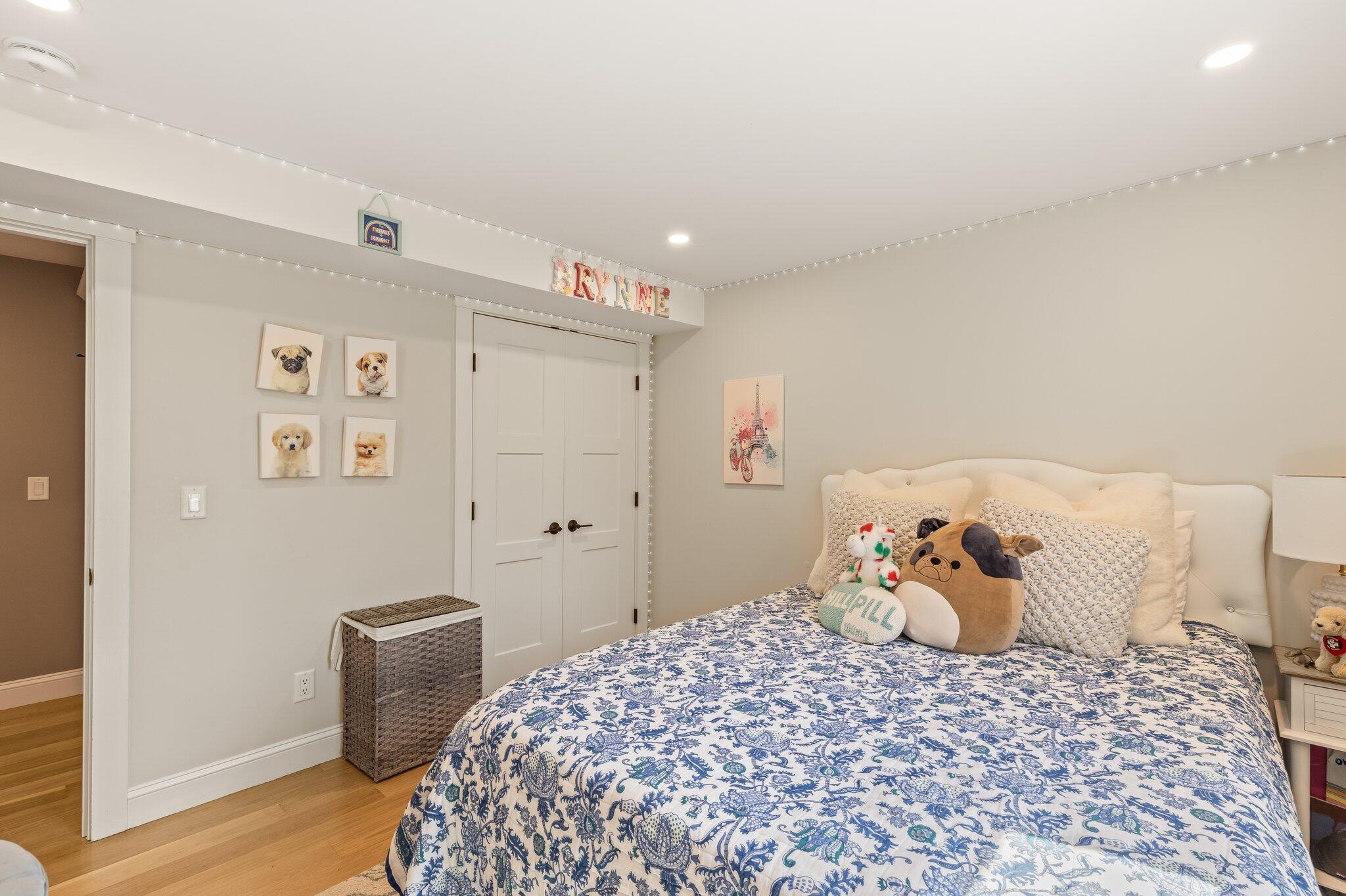 87 Oyster Pond Road Falmouth, MA 02540 - Photo 42 of 105 a bedroom with a bed and wooden floor
