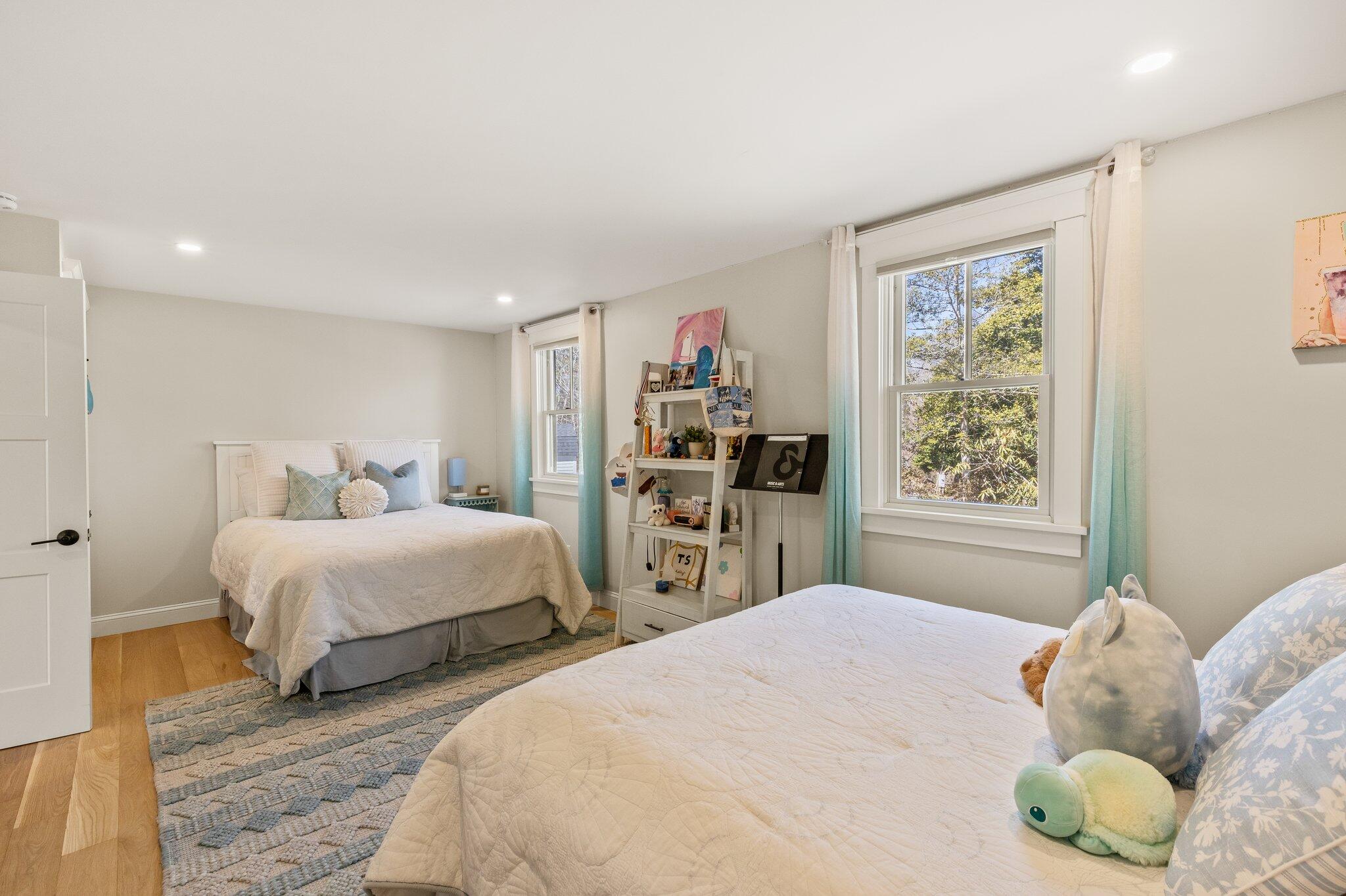 87 Oyster Pond Road Falmouth, MA 02540 - Photo 48 of 105 a bedroom with two beds and a large window