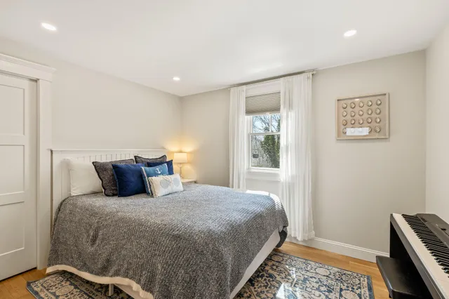 an aerial view of a house with a lake view