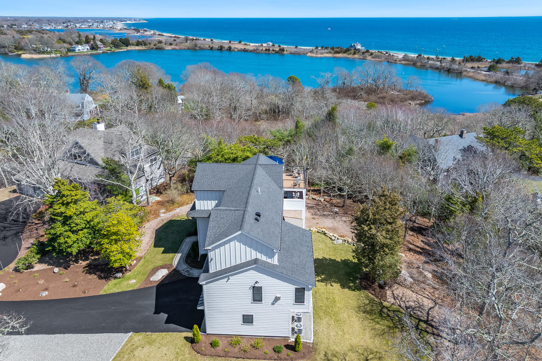 87 Oyster Pond Road Falmouth, MA 02540 - Photo 71 of 105 an aerial view of a house with a lake view