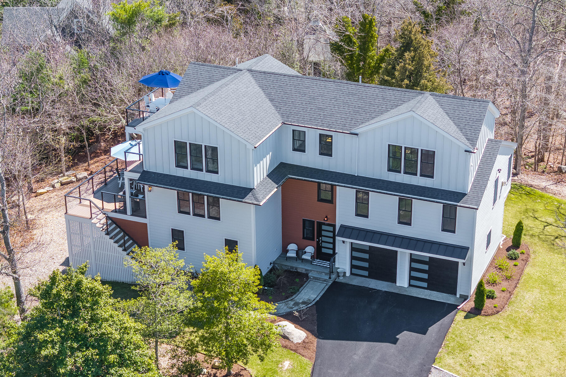 87 Oyster Pond Road Falmouth, MA 02540 - Photo 74 of 105 a aerial view of a house next to a yard