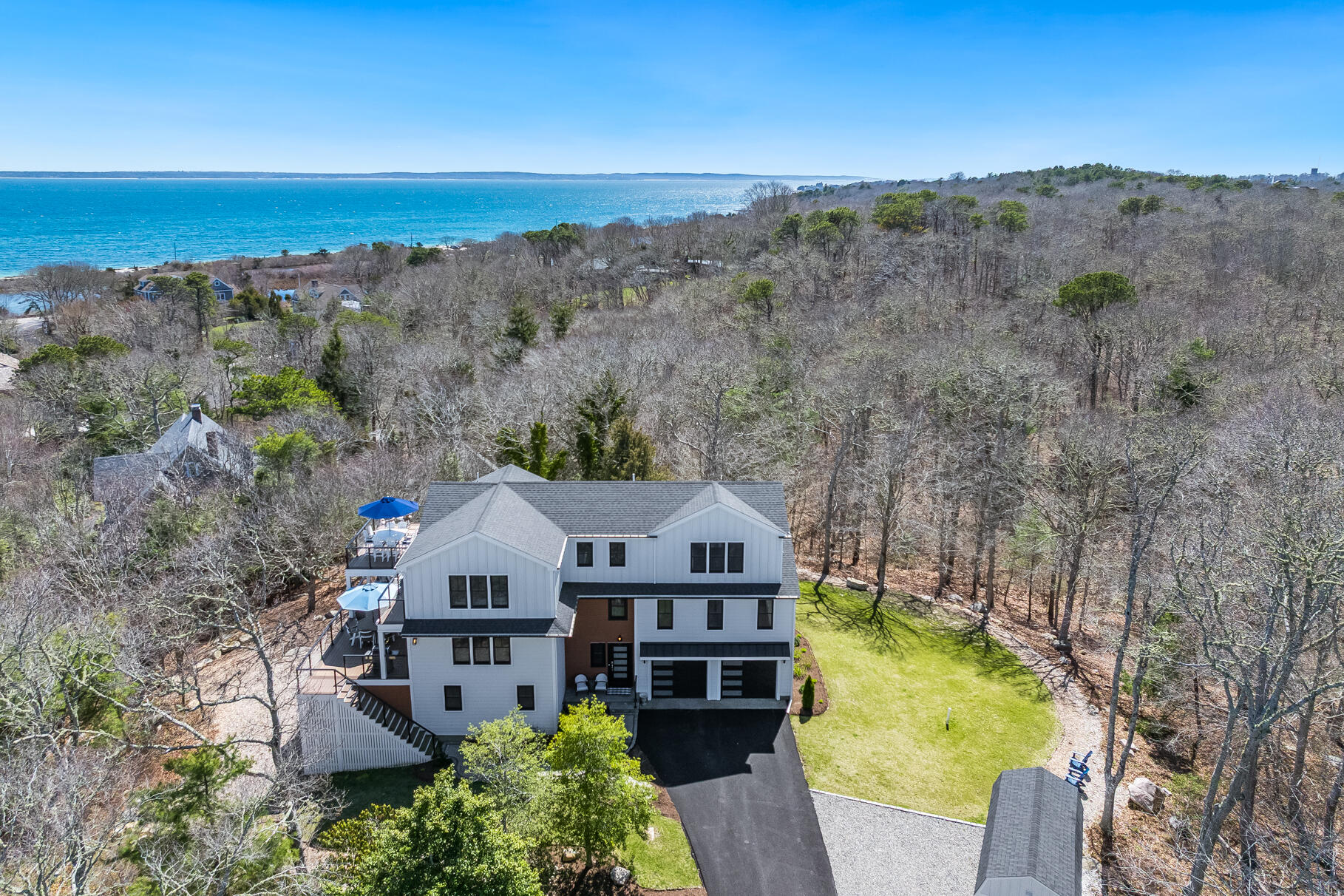 87 Oyster Pond Road Falmouth, MA 02540 - Photo 76 of 105 an aerial view of a house with a yard