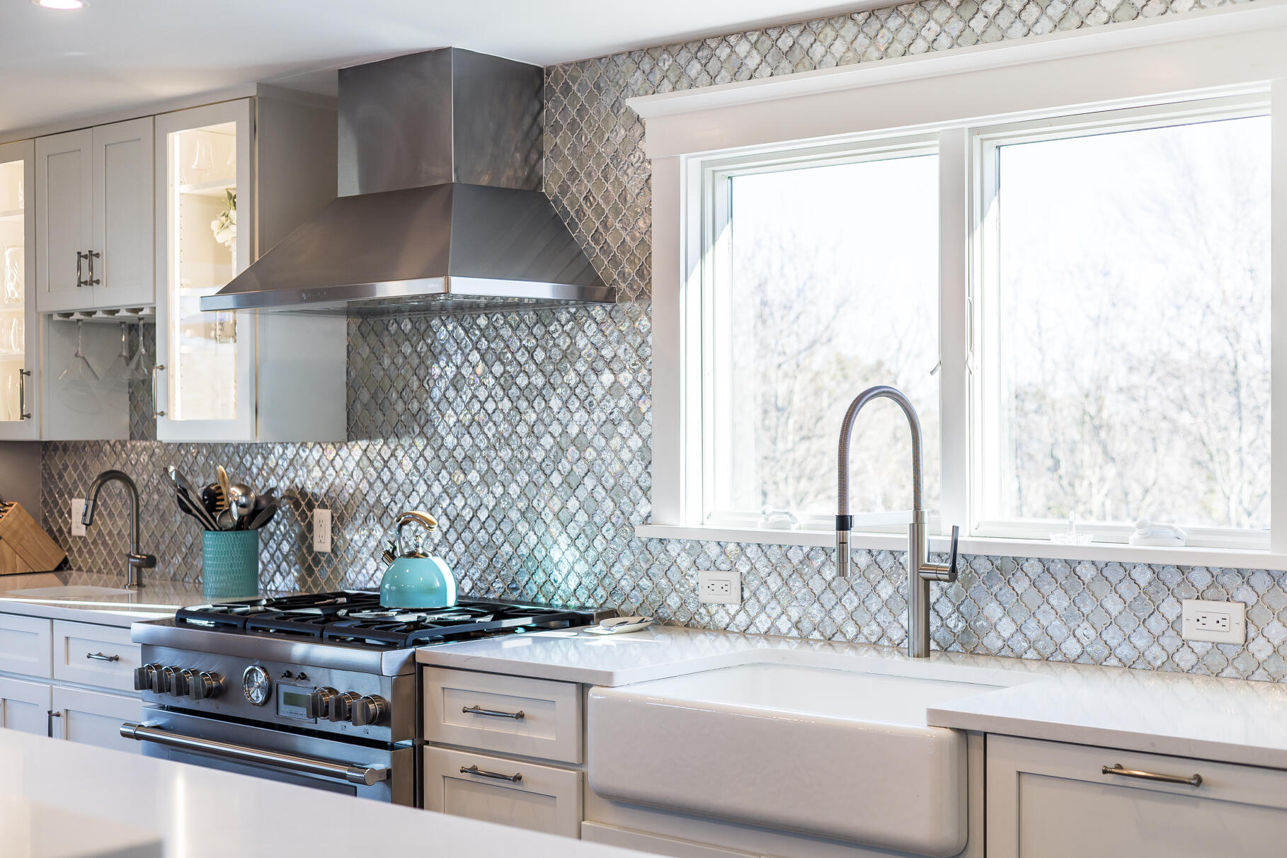 87 Oyster Pond Road Falmouth, MA 02540 - Photo 10 of 105 a kitchen with a stove a sink and a window