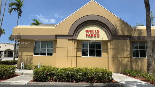 a view of a brick house with a large windows