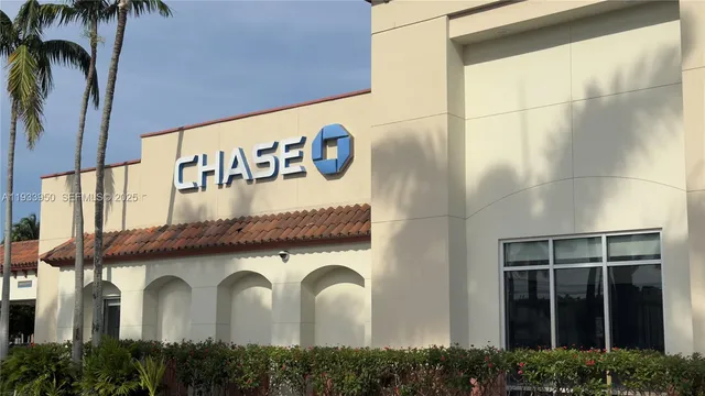 a front view of a building with garden