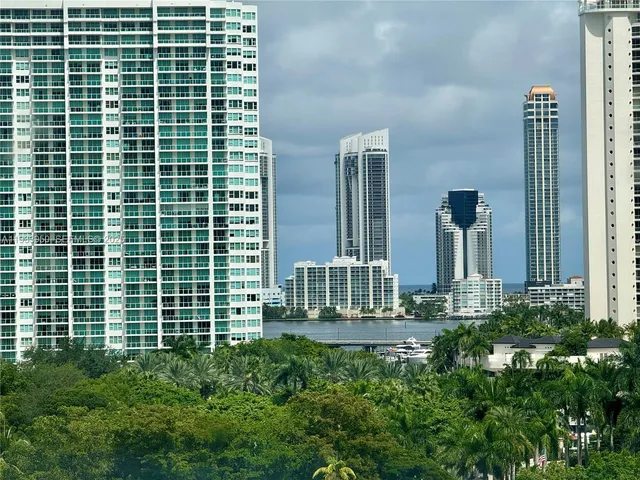 a view of a building with windows and plants