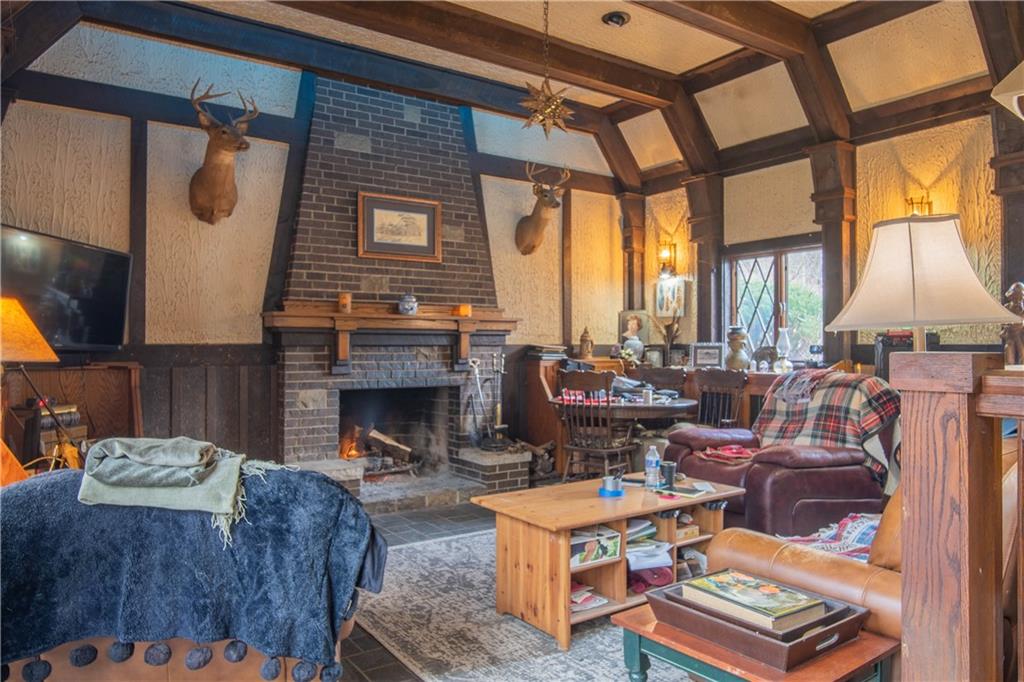 280 Ferry Road Sewickley, PA 15143 - Photo 14 of 21 a living room with furniture a fireplace and a large window