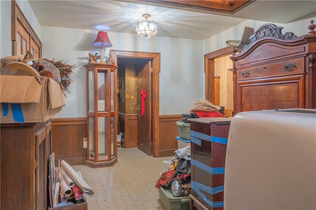 280 Ferry Road Sewickley, PA 15143 - Photo 7 of 21 a bedroom with a bed and a chandelier