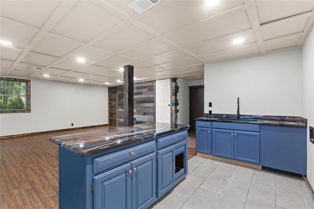 295 Coleman Road Homer, LA 71040 - Photo 26 of 38 a kitchen with stainless steel appliances granite countertop a stove and a sink