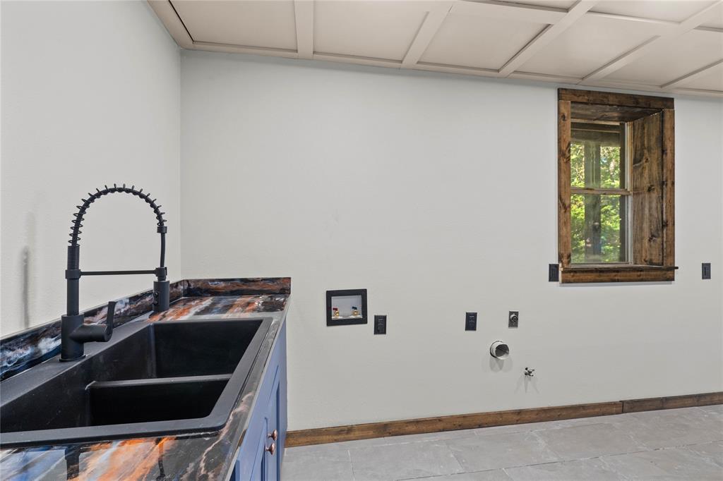 295 Coleman Road Homer, LA 71040 - Photo 27 of 38 a kitchen with a sink and a stove top oven