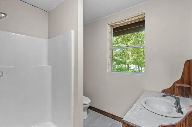 an outdoor view of house with yard and entertaining space