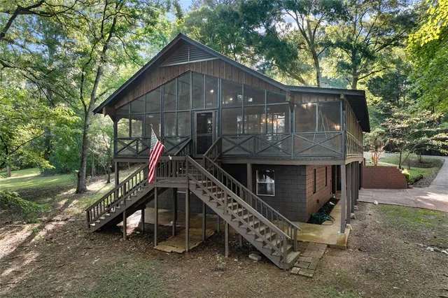 a view of a house with a yard and plants