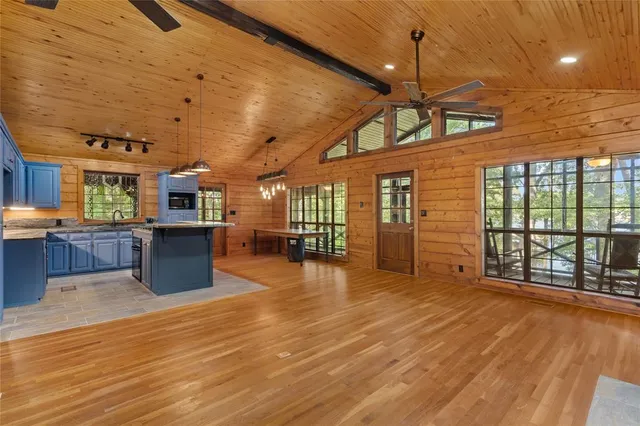 a view of a room with wooden floor