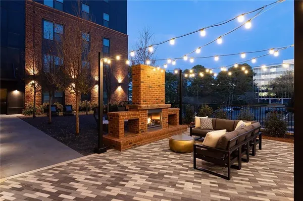 a outdoor living space with patio furniture and a potted plant