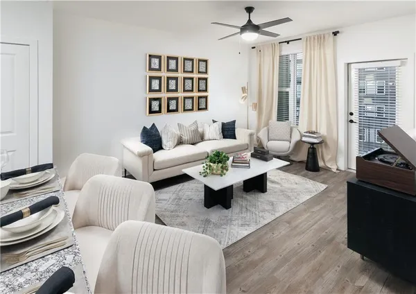 a living room with furniture and a fireplace