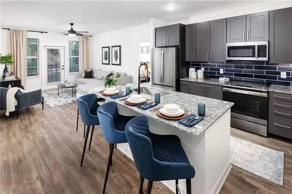 a kitchen with a dining table and chairs