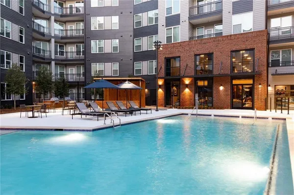 a view of pool with outdoor seating