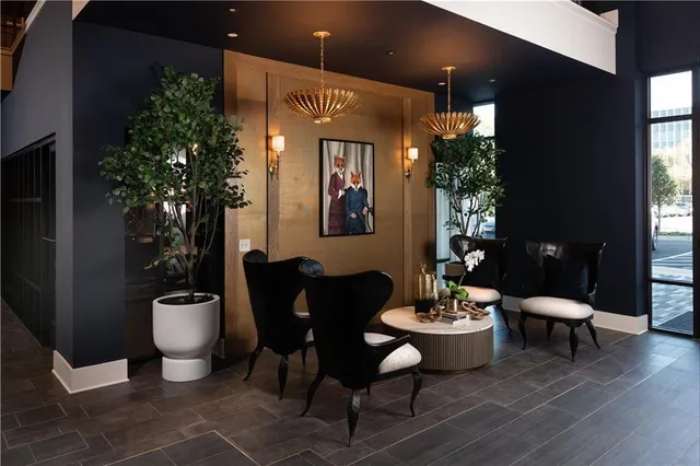 a lobby with furniture and potted plant