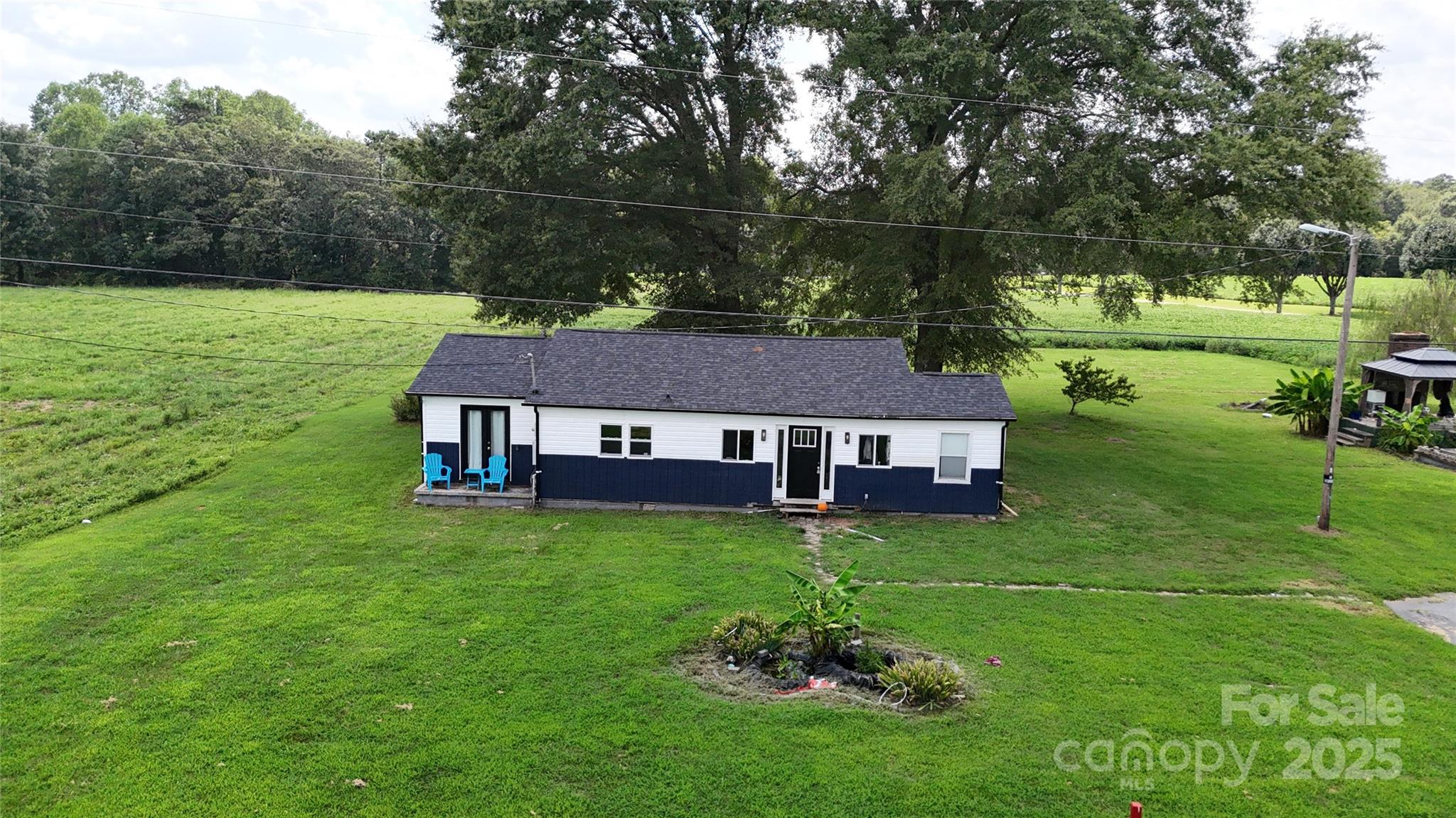 751 Northbrook III School Road Vale, NC 28168 - Photo 2 of 11 a view of a house with a big yard