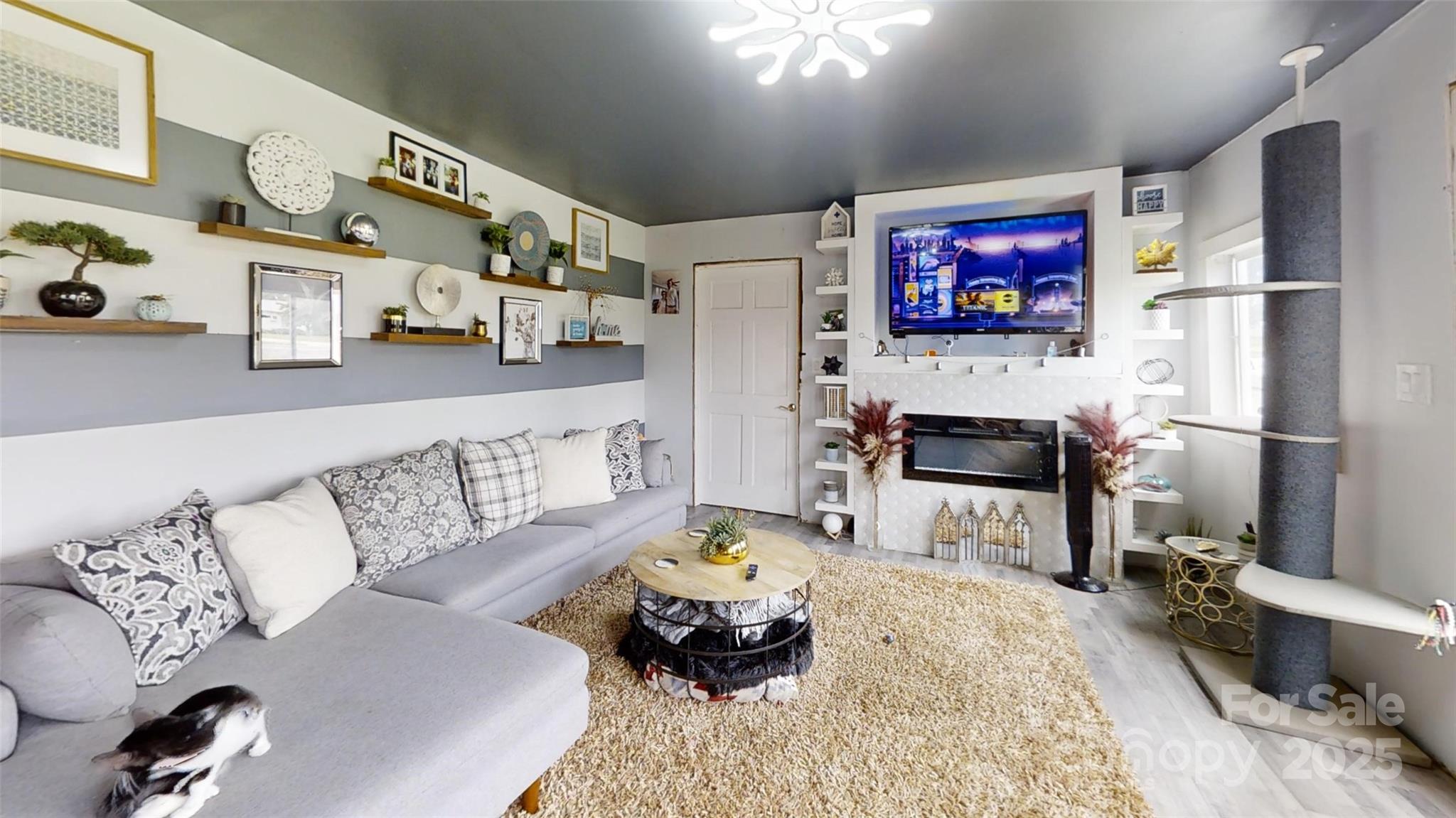 751 Northbrook III School Road Vale, NC 28168 - Photo 3 of 11 a living room with furniture and a flat screen tv