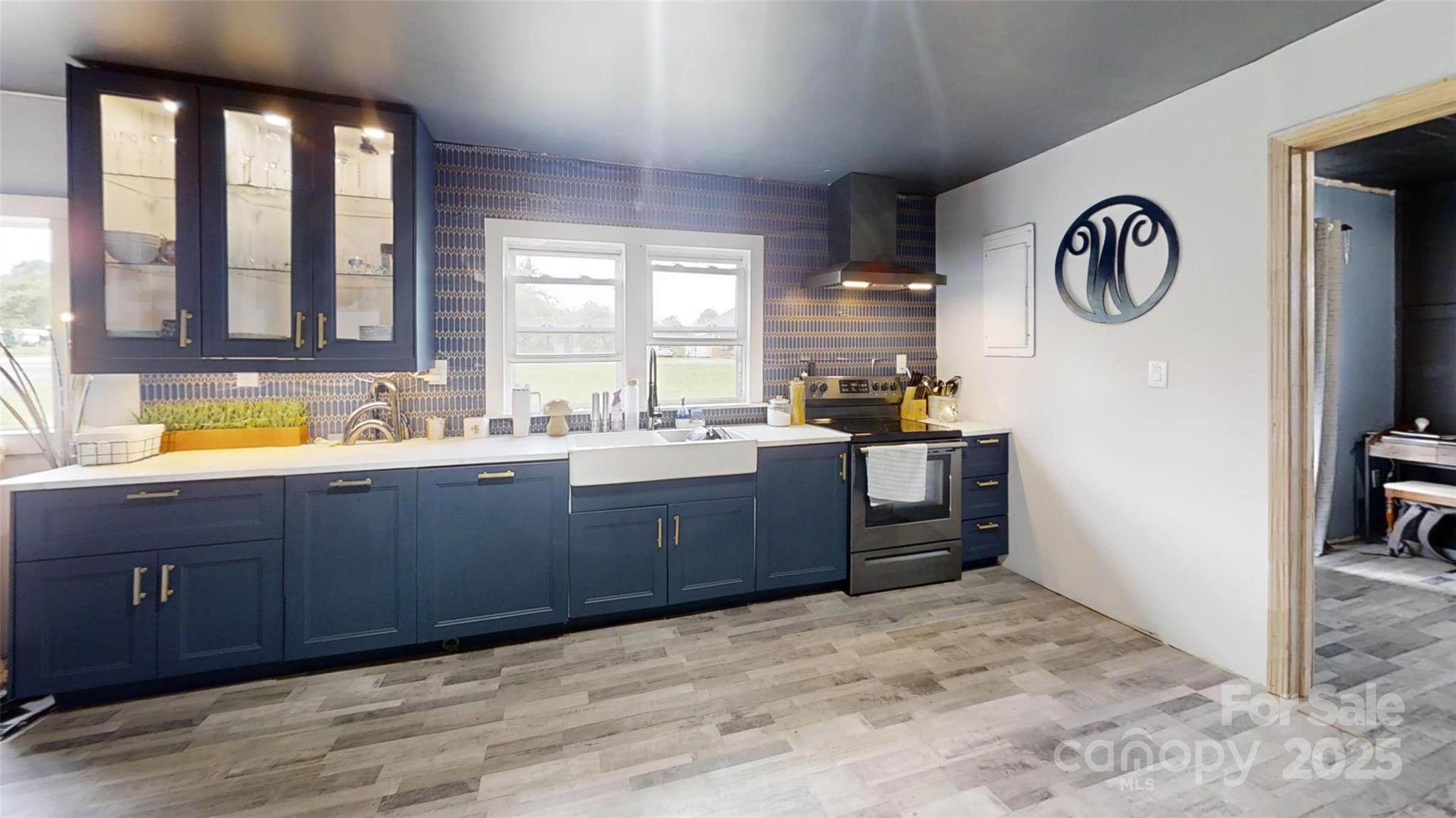 751 Northbrook III School Road Vale, NC 28168 - Photo 5 of 11 a large kitchen with a sink and a large window