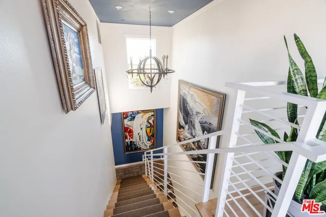 a view of a livingroom with furniture and entryway