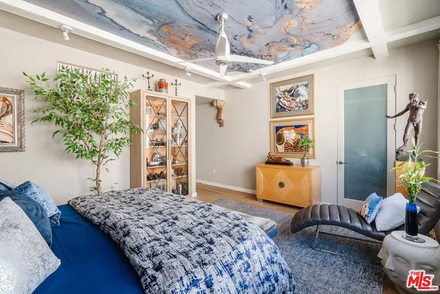 a bedroom with a bed and a couch